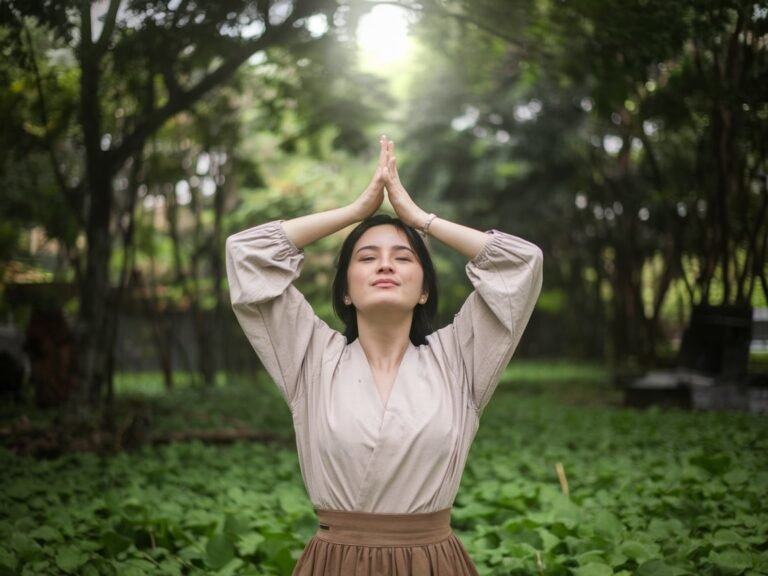 A person practicing mindfulness meditation in a peaceful outdoor setting, highlighting stress management techniques.